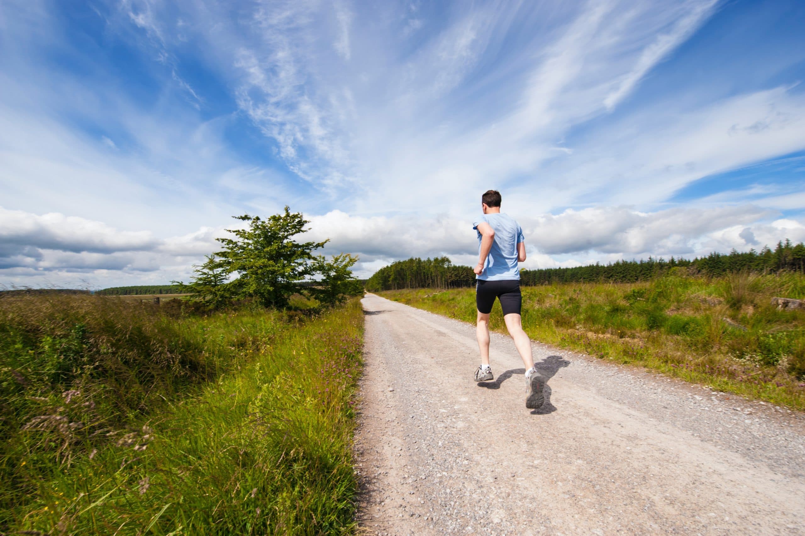 Active patient running on country road
