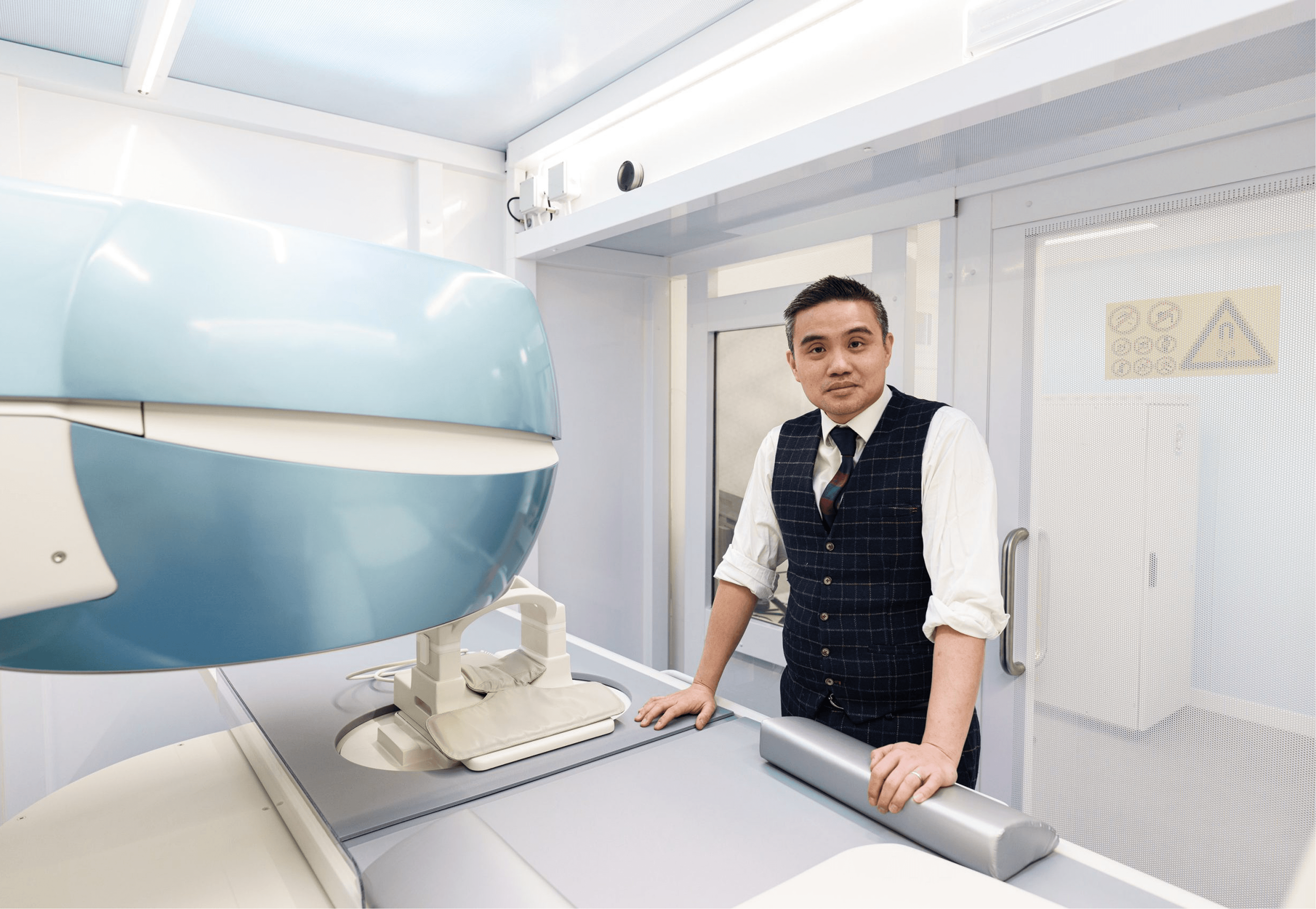 Professor Paul YF Lee reviewing MRI imaging for knee treatment planning