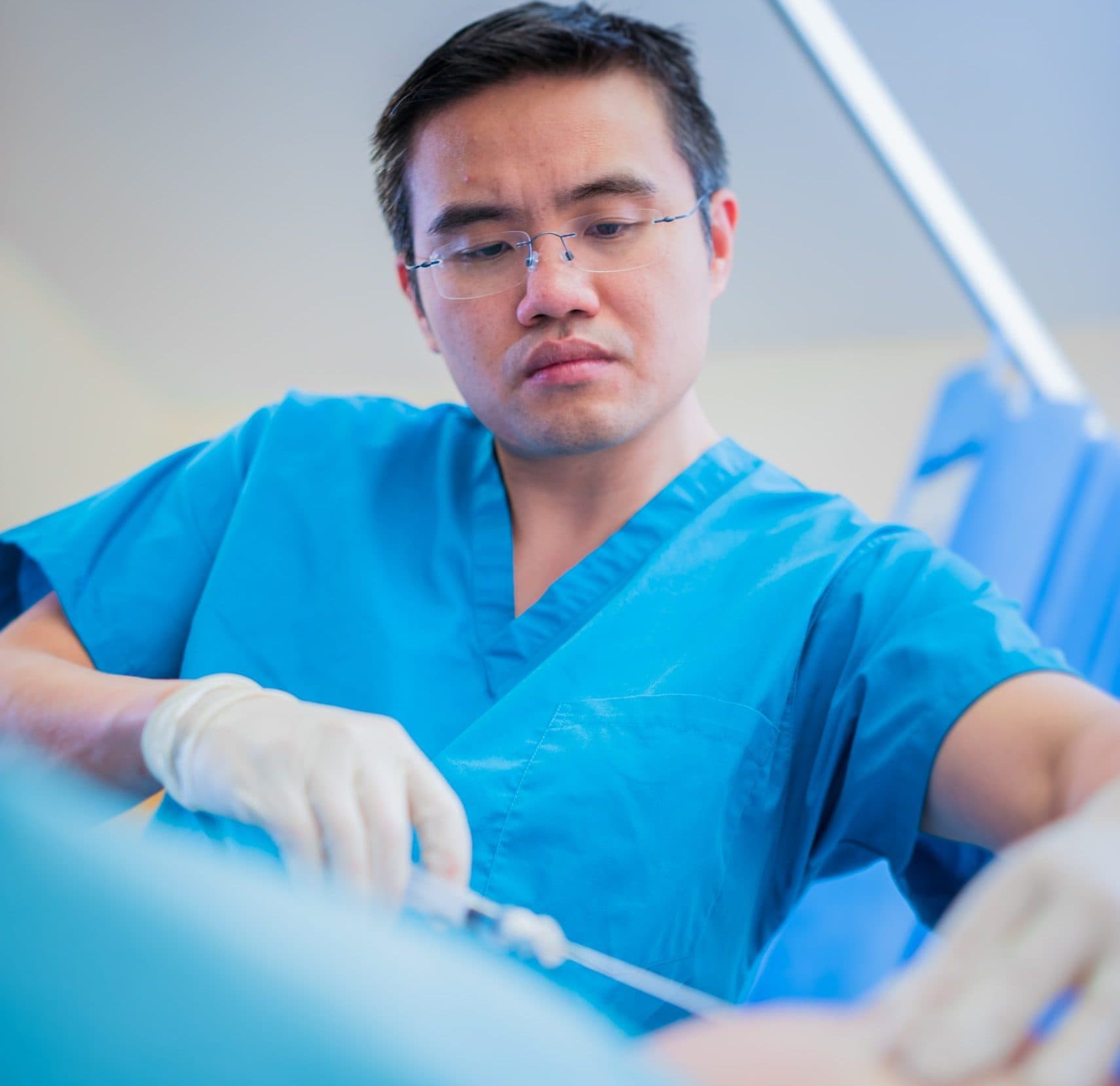 Surgeon performing a joint procedure in theatre